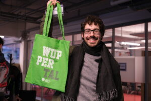 participant at the crbam 2023 holding a green bag